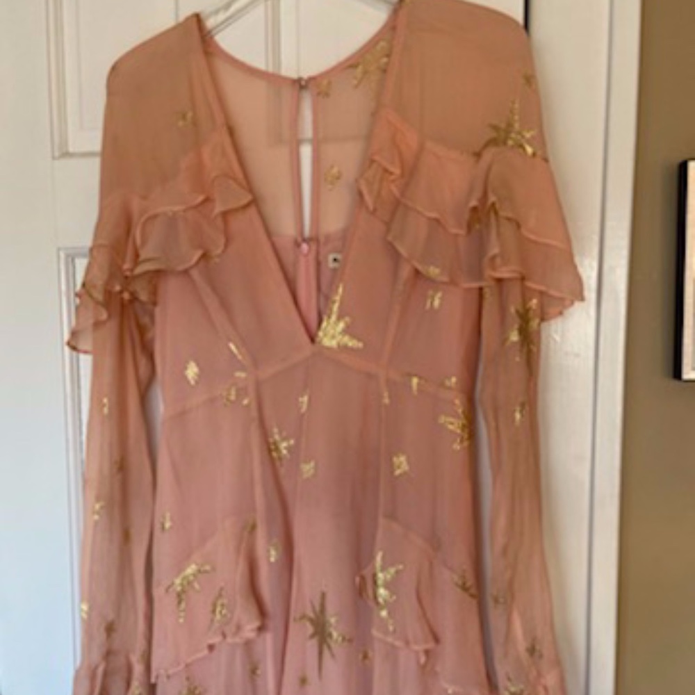 Super fun party top with gold accents that shine